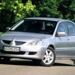 Радиатор основной охлаждения к Митсубиси Лансер 2000-2007 г