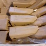 Зубья, коронки, адаптеры, защита ковшей экскаваторов и погрузчиков